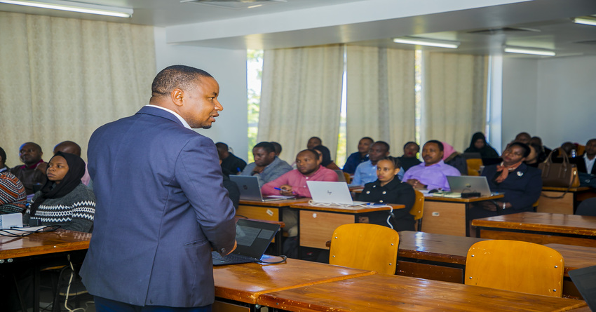 PPRA Director of Information Systems, Michael Moshiro, presents to government officials on the new e-procurement system named NeST,  July 10, 2023 Iringa